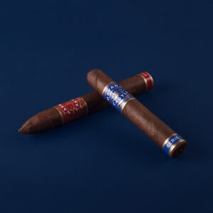 Red and blue cigars crossed on blue surface